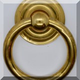D27. Brass ring-shaped door knocker. - $20 
